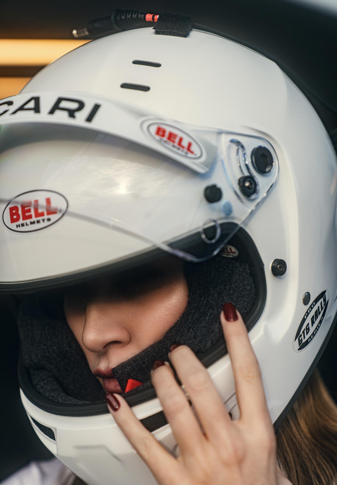 Carmen wearing a race helmet facing downwards