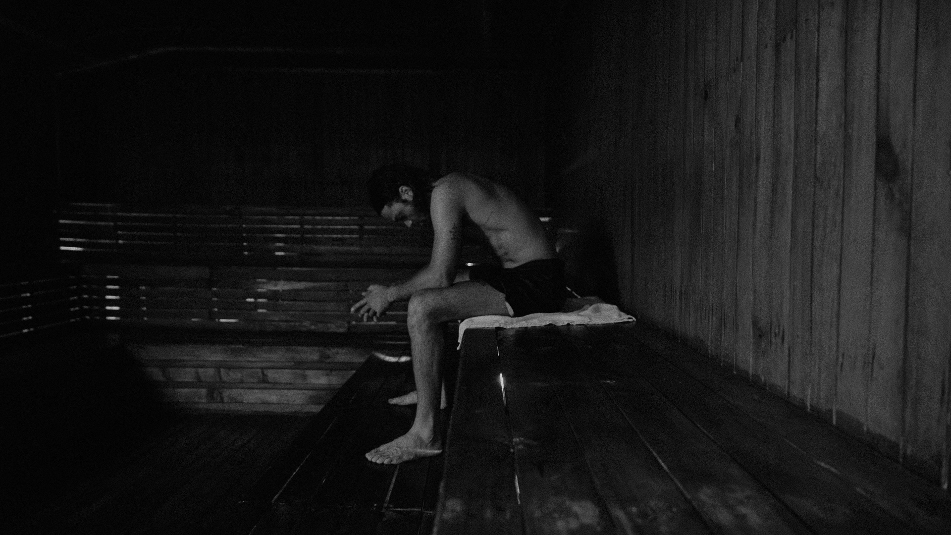Naleye sitting in a sauna