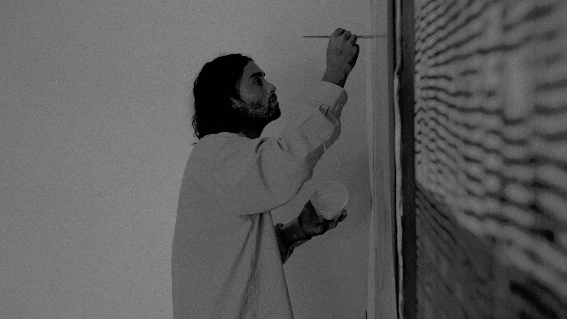 Naleye working on a painting